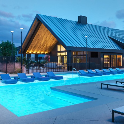 Relax and unwind poolside tanning shelf with loungers in pool